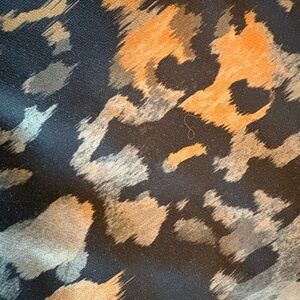 Fabletics High-waist Black, Rust, and Brown Leopard Print Leggings.